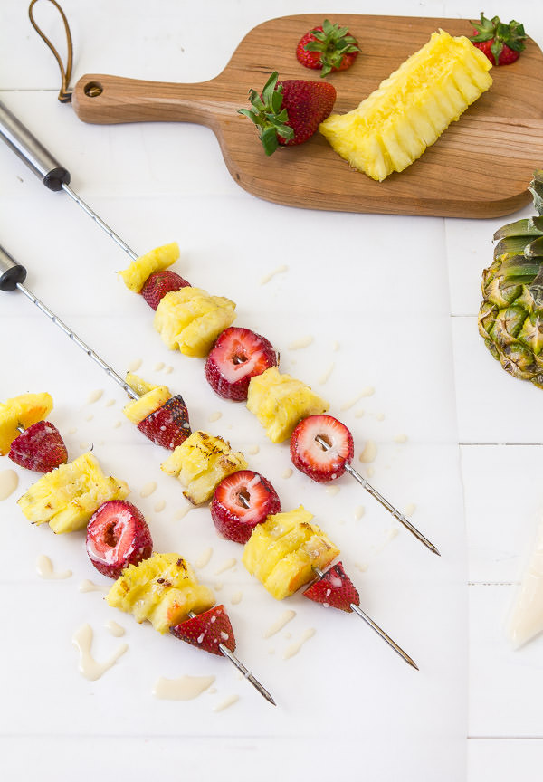 grilled pineapple and strawberry skewers with bourbon white chocolate glaze